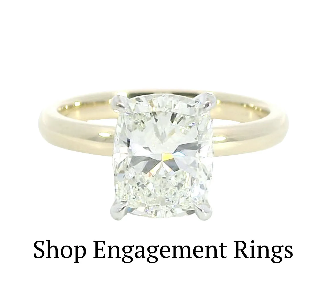 Cushion-cut diamond engagement ring on a gold band. Click to shop engagement rings at Cozzi Jewelers, Newtown Square.