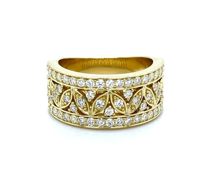 Gold ring with intricate design and sparkling diamonds
