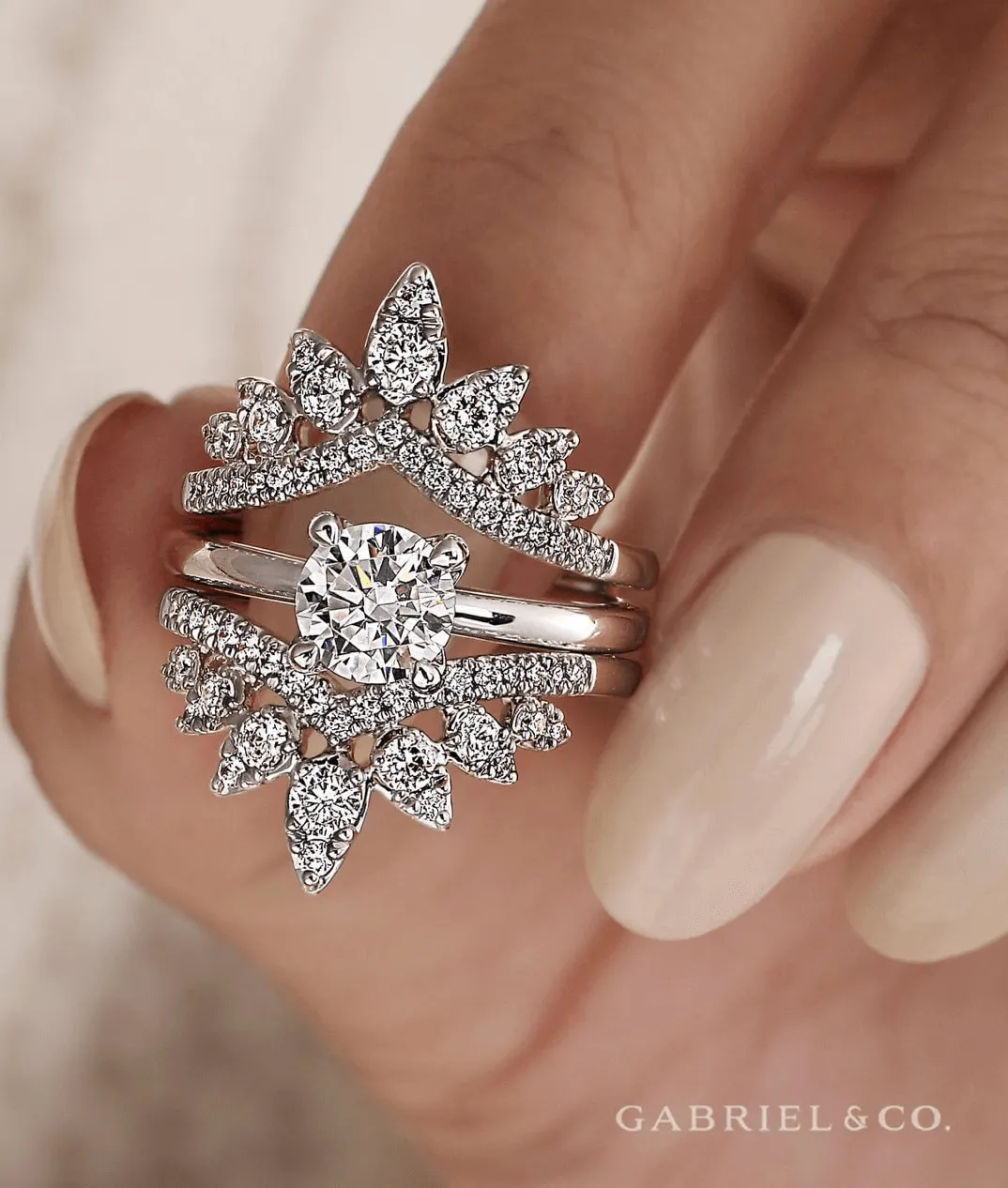 Close-up of ASHI rings on hands. Click to explore ASHI collections at Dahlkemper's Jewelry Connection in Erie.