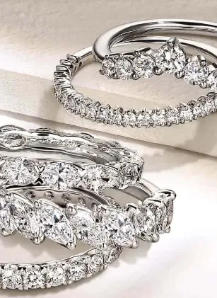 Elegant Ostbye bridal rings featuring diamonds and gold. Click to explore more at Dahlkemper's Jewelry Connection in Erie!