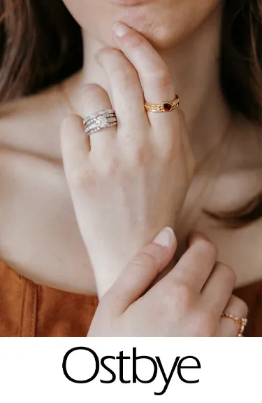 Elegant Ostbye bridal rings featuring diamonds and gold. Click to explore more at Dahlkemper's Jewelry Connection in Erie!