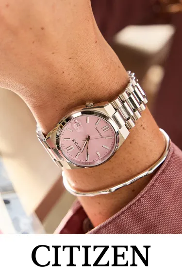 Man wearing a pink Citizen watch. Click to explore more at Dahlkemper's Jewelry Connection.