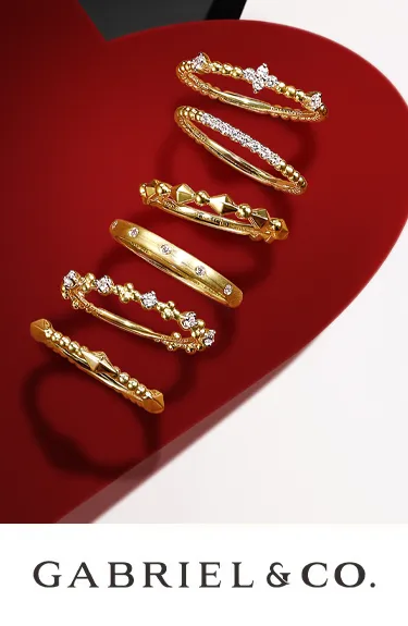 Elegant gold rings from Gabriel & Co.; click to explore more at Dahlkemper's Jewelry Connection in Erie.