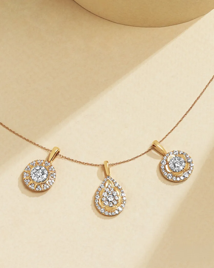 Diamond pendants on gold chain; click to explore more diamond pendants at Dahlkemper's Jewelry Connection.