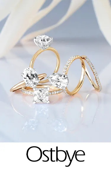 Elegant Ostbye bridal rings featuring diamonds and gold, showcasing Dahlkemper's Jewelry Connection in Erie. Click to explore!