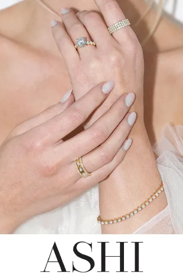 Close-up of ASHI rings on hands. Click to explore ASHI collections at Dahlkemper's Jewelry Connection in Erie.