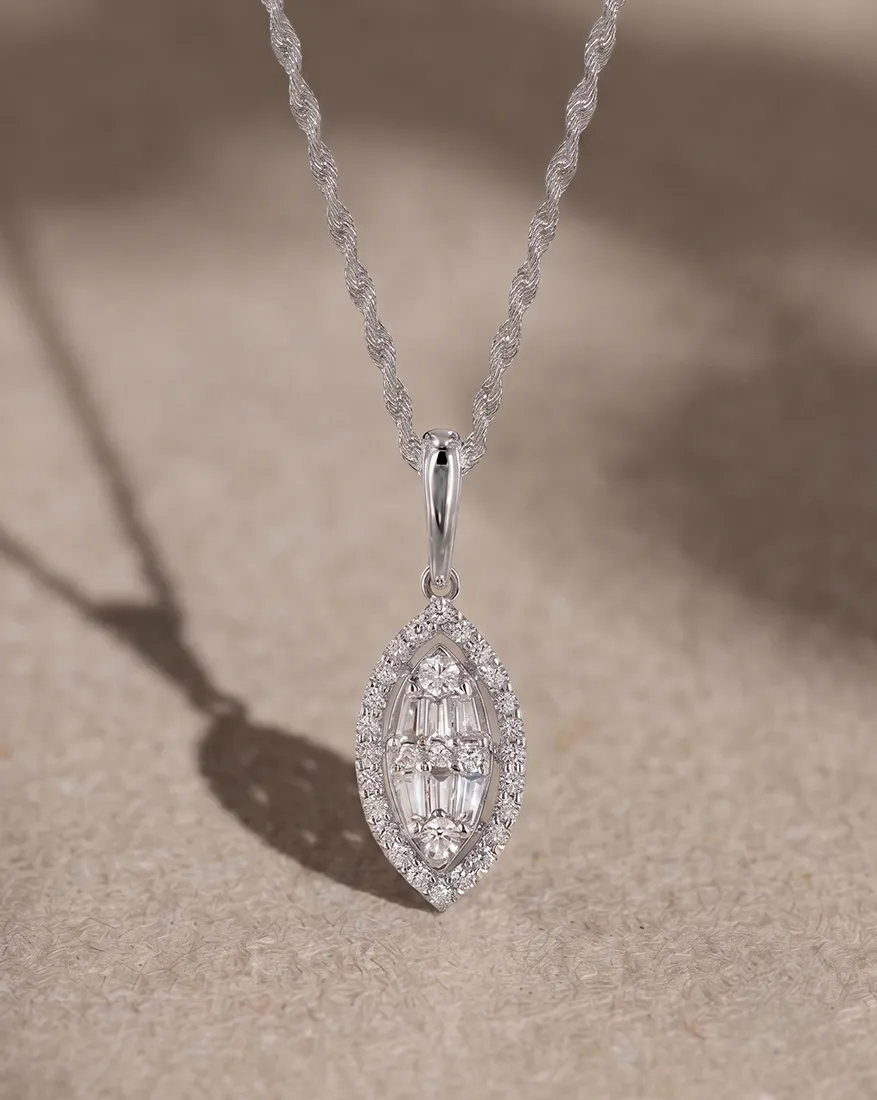 Diamond pendant with intricate design on a twisted silver chain.