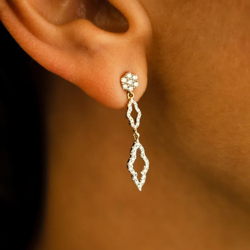 Elegant diamond drop earrings featuring a floral stud and intricate design, perfect for any occasion.