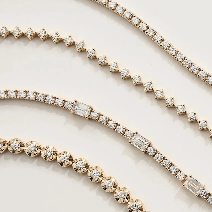 Elegant gold bracelets adorned with sparkling diamonds, showcasing various styles and designs.