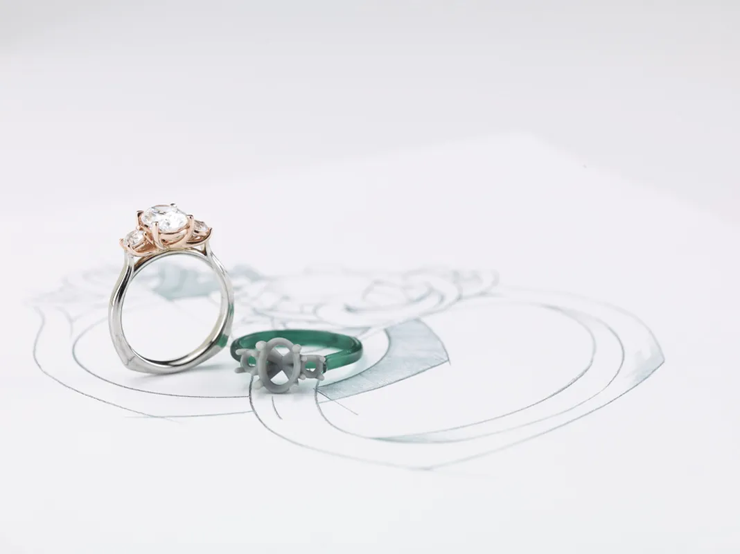 Engagement ring and design sketch on a white background.