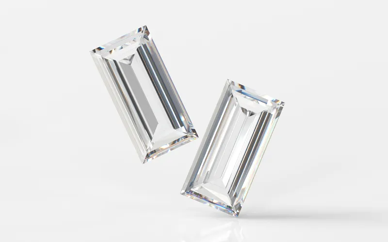 Two sparkling rectangular diamonds on a white background.