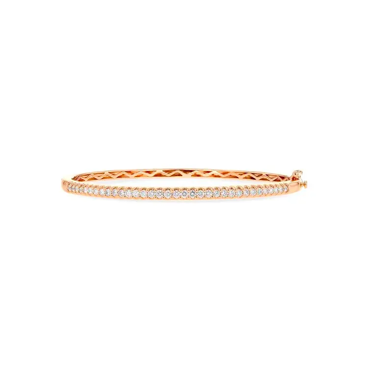 Rose gold bangle bracelet with sparkling diamonds, available at D'Errico Jewelry. 