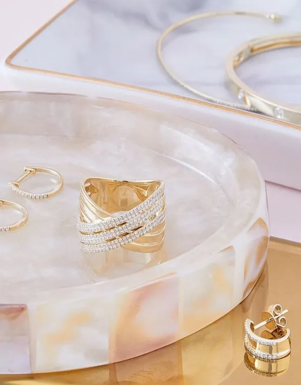 Custom Gold Jewelry on a Marble Plate