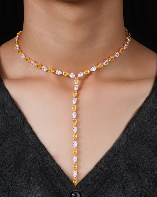 Elegant yellow and white gemstone necklace worn on a model's neck, showcasing a unique design.