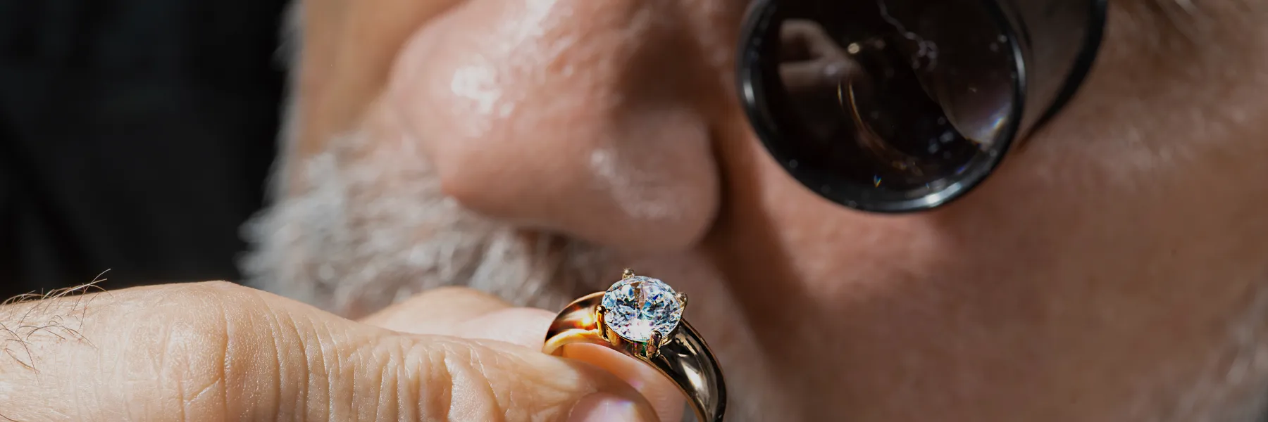 Man appraising a diamond ring