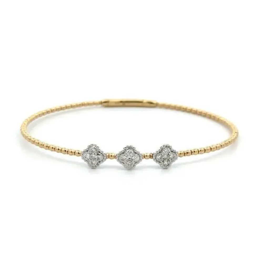 Gold bracelet with three diamond-studded floral motifs. Click to shop bracelets.