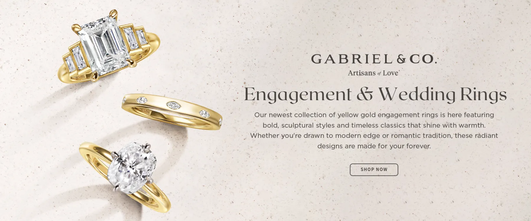 Three gold rings with diamonds on a textured background. Shop engagement and wedding rings from Gabriel & Co.