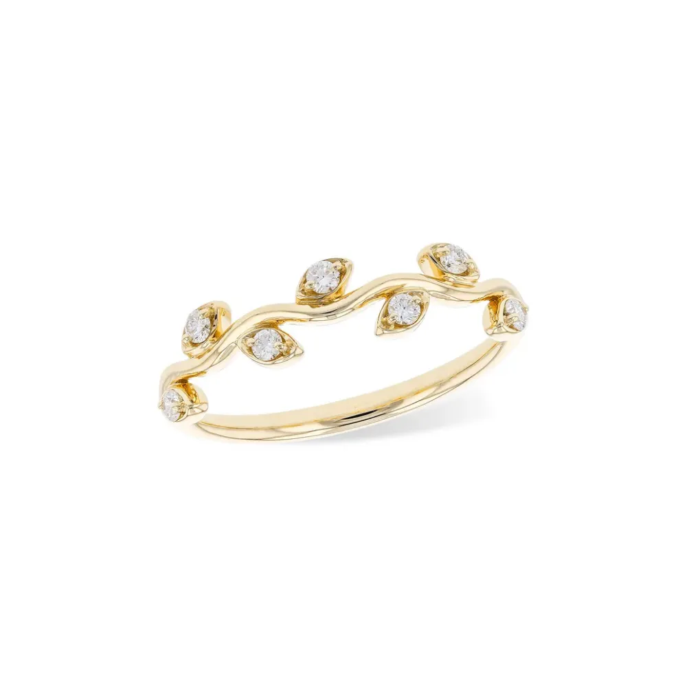 Gold ring with leaf-shaped diamond accents. Click to shop rings.