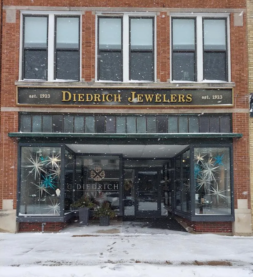 Owner Shelly holding jewelry display at Diedrich Jewelers, Ripon.