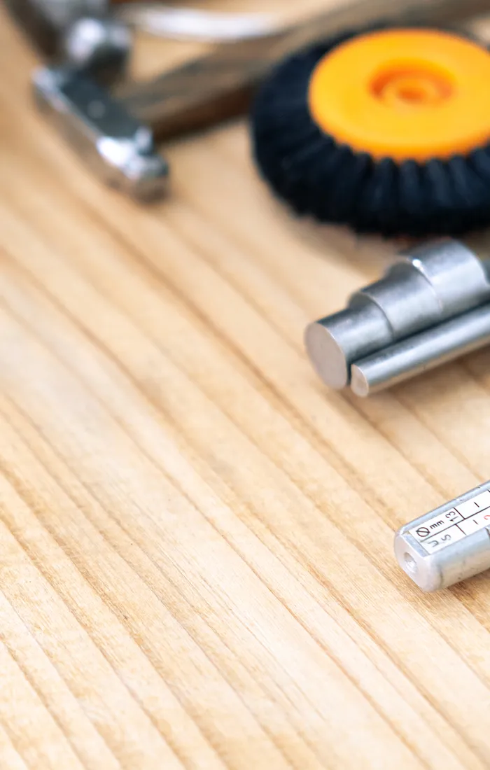 Jewelry tools on a wooden surface. Schedule a consultation at Diedrich Jewelers.