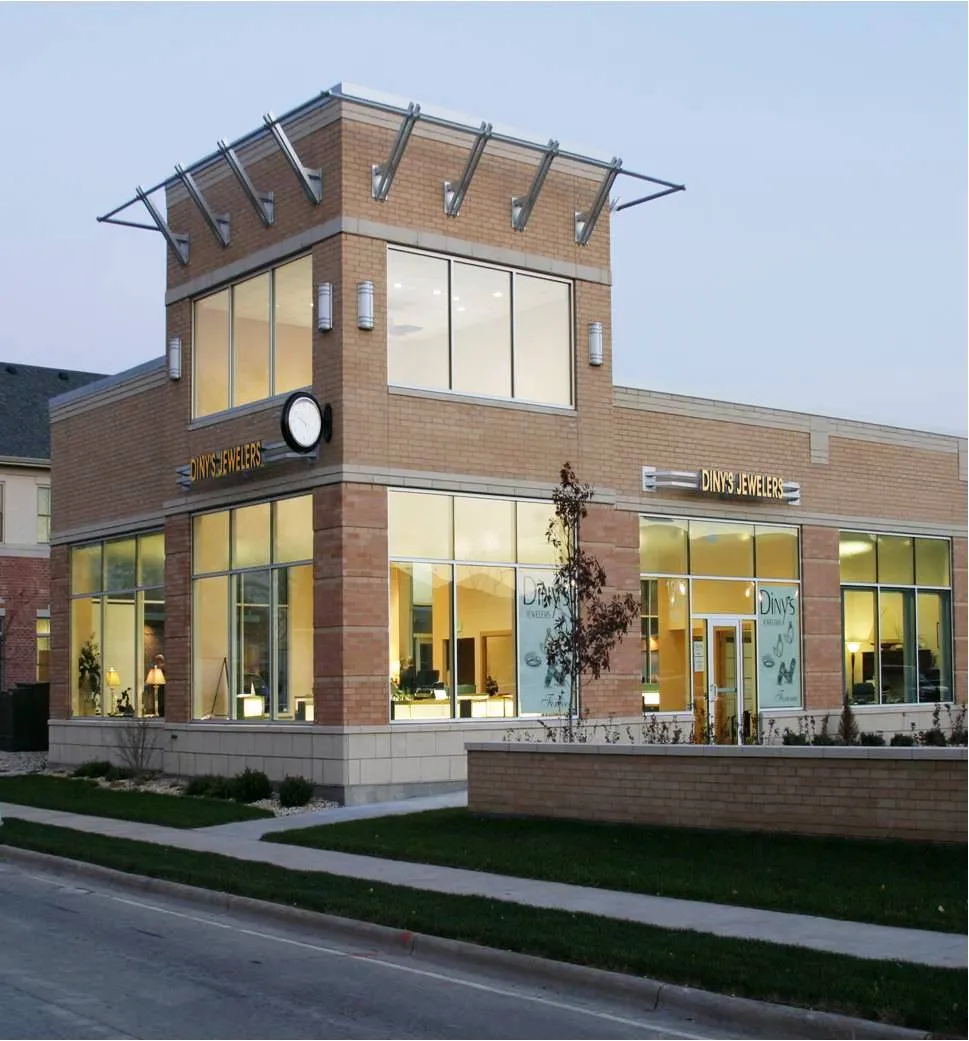 Exterior view of Diny's Jewelers store in Middleton with large windows and a clock.