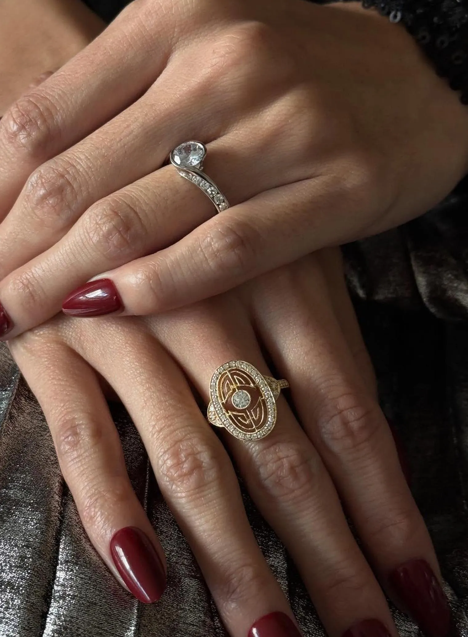 A yellow diamond ring with a sparkling band displayed on a textured surface.