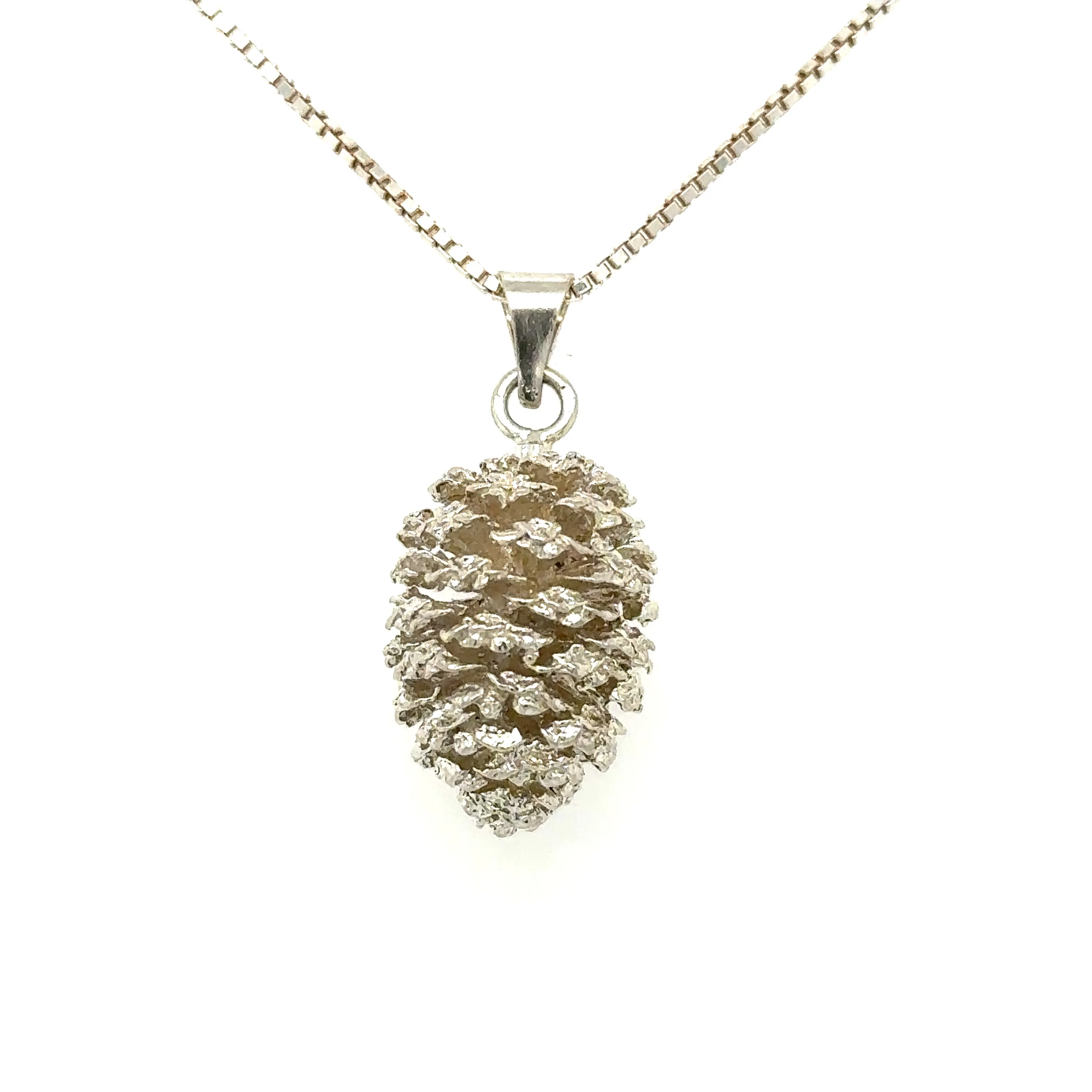 Lake Tahoe Pinecone Collection Experience the natural beauty of Lake Tahoe with our stunning Lake Tahoe Pinecone Jewelry Collection. Each piece is carefully handcrafted from real pinecones found along the floors of the Tahoe National Forrest. We preserve each pinecones natural shape, texture, intricate patterns & one-of-a-kind natural imperfections by carefully hand casting each one. Each piece varies in size & shape but is about 3/4 inch in size. Bring in your own Tahoe Alder Pinecone that you've found & we will cast it & create a one of a kind beautiful piece that you will treasure or enjoy gifting! Double Diamond Jewelry Olympic Valley, CA