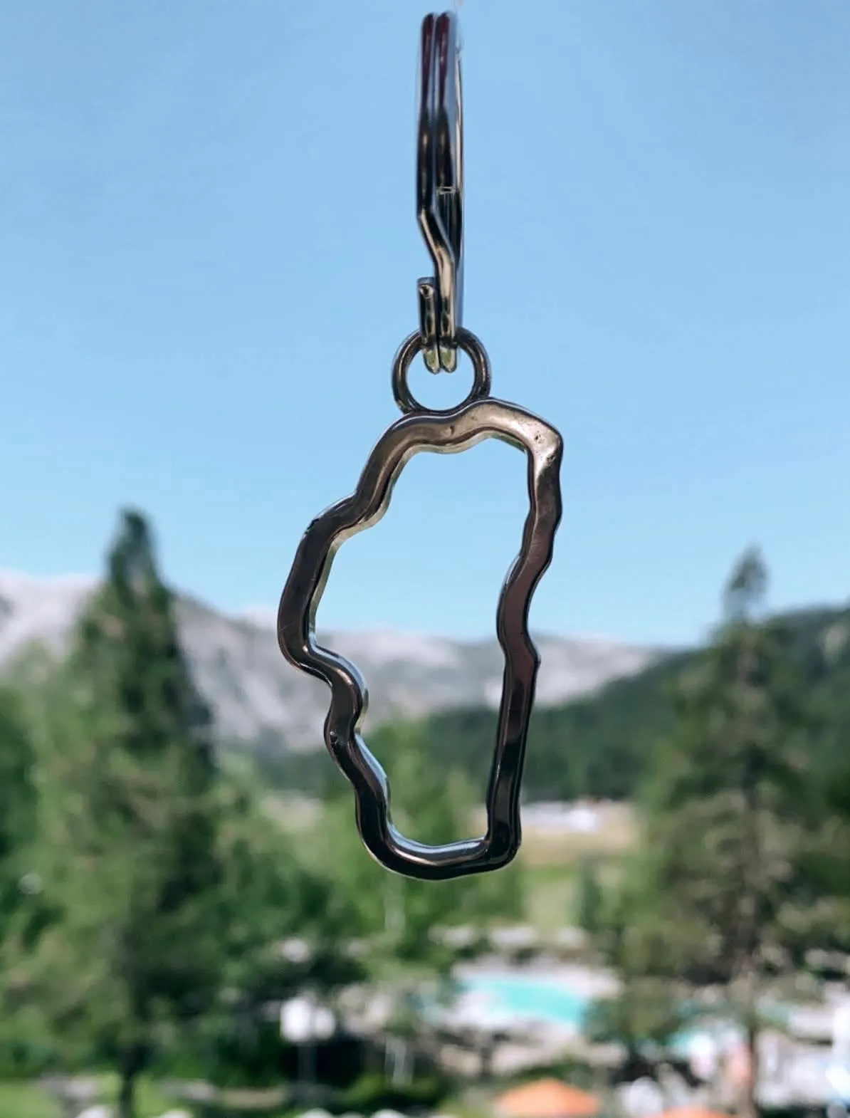 Tahoe Keychains Our handcrafted Lake Tahoe frame keychains, are the perfect souvenir for both locals & visitors alike. Each keychain is carefully handcrafted with intricate details that capture the beauty & essence of Lake Tahoe. Whether you're a local who wants to show off your love for your hometown or a visitor looking for a unique keepsake, our Lake Tahoe Keychains are the perfect choice. They make for a great addition to any keychain collection and are sure to spark conversations & memories of your time in Tahoe! Available in Stering Silver, Zinc,Brass & Copper.  Double Diamond Jewelry Olympic Valley, CA