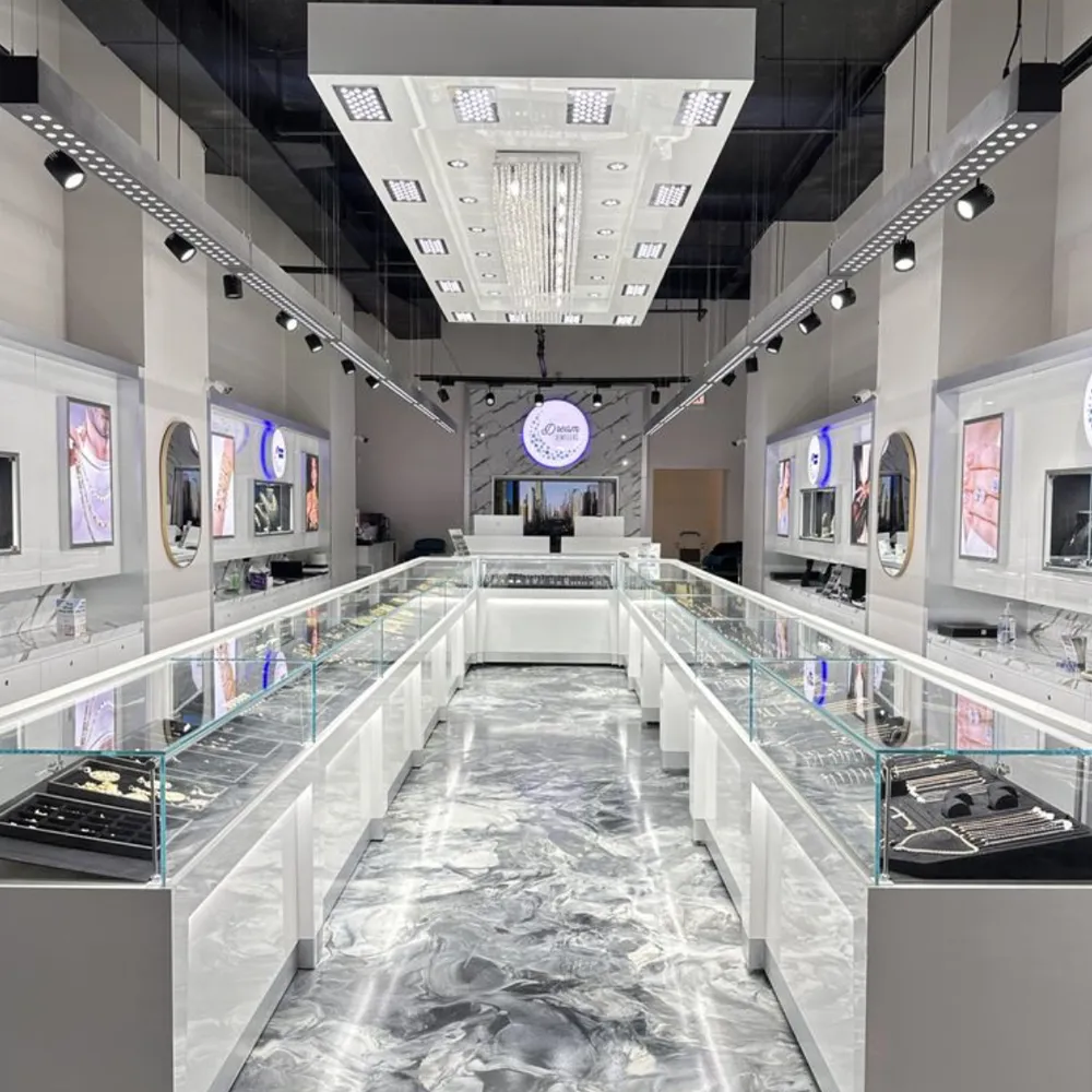 Modern jewelry store interior with glass display cases and elegant lighting at Dream Jewelers in Chicago.