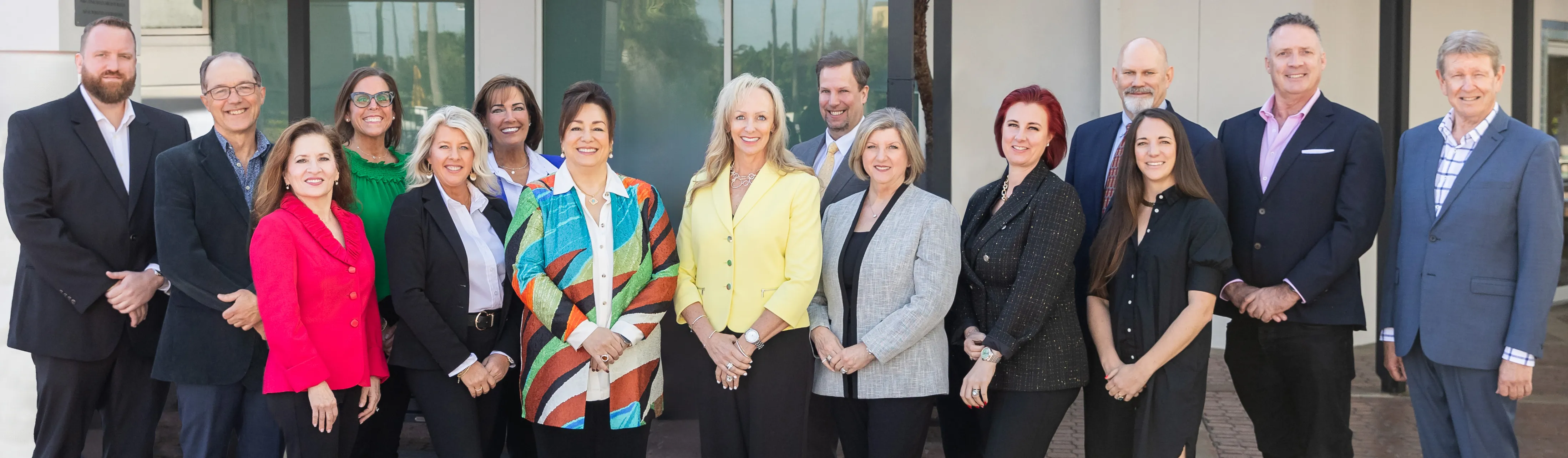 Group photo of Edge Retail Academy team members in Omaha, showcasing diverse attire and smiling faces. Contact: Info@EdgeRetailA