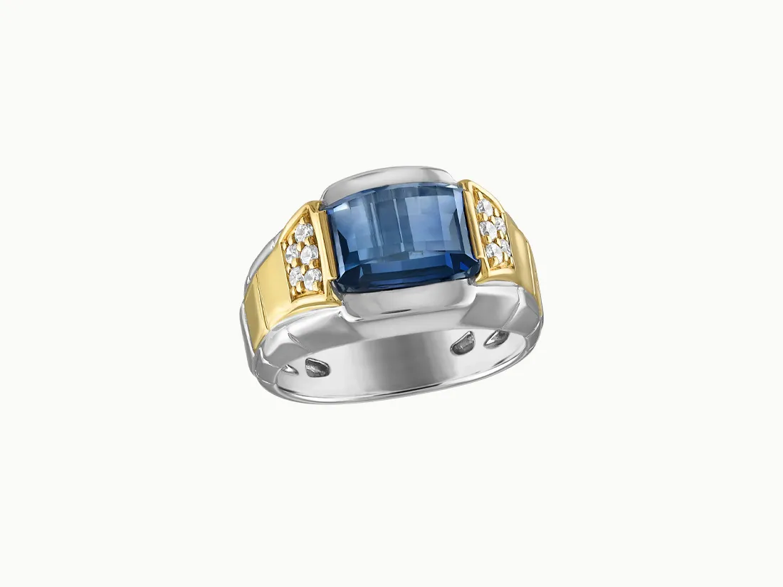 Men's ring featuring a large blue stone and diamond accents, set in silver and gold. Click to explore more Men's Jewelry.