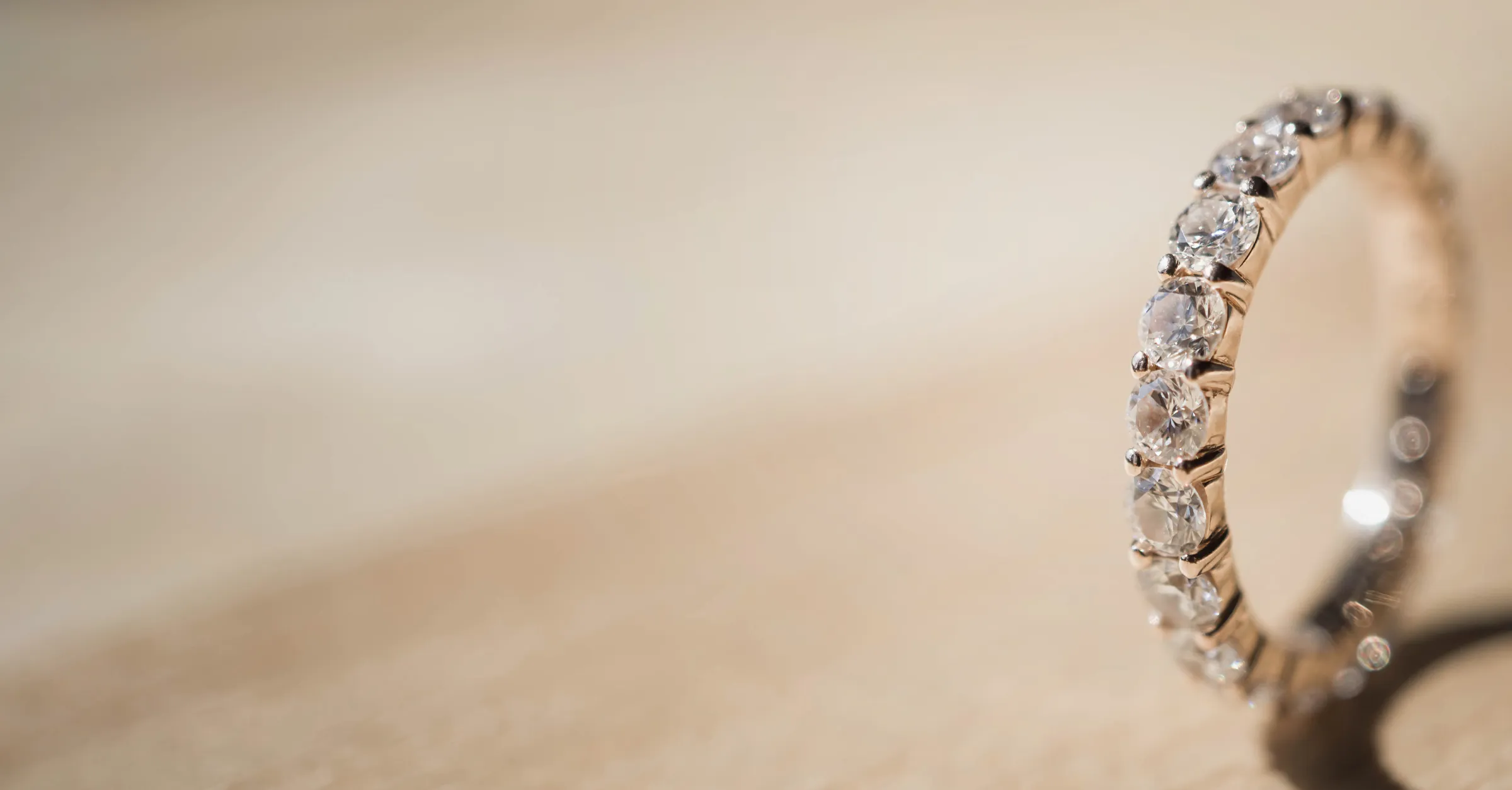 Close-up of a diamond ring on a soft background. Click to make an appointment at E.G. Landis Jewelers, Gilbertsville.