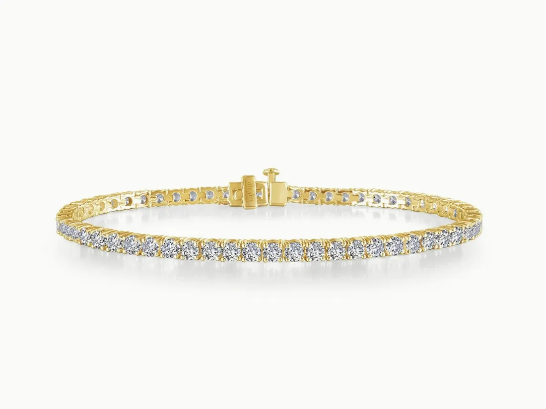 Gold bracelet with sparkling diamonds, perfect for elegant occasions. Click to explore more bracelets at E.G. Landis Jewelers.
