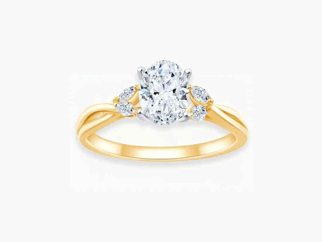 Stylish two-tone wedding band featuring a brushed gray center and polished gold edges. 