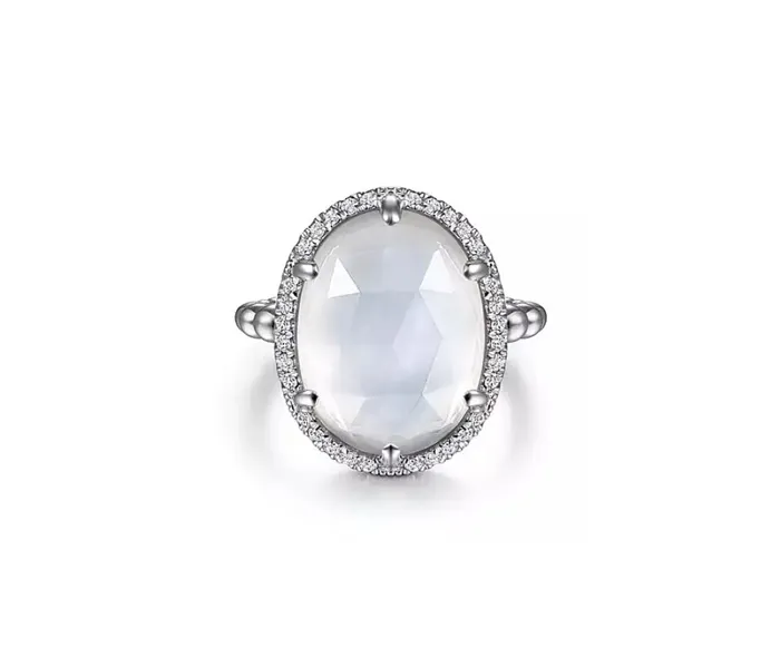 Elegant silver ring featuring a large oval moonstone surrounded by sparkling diamonds.