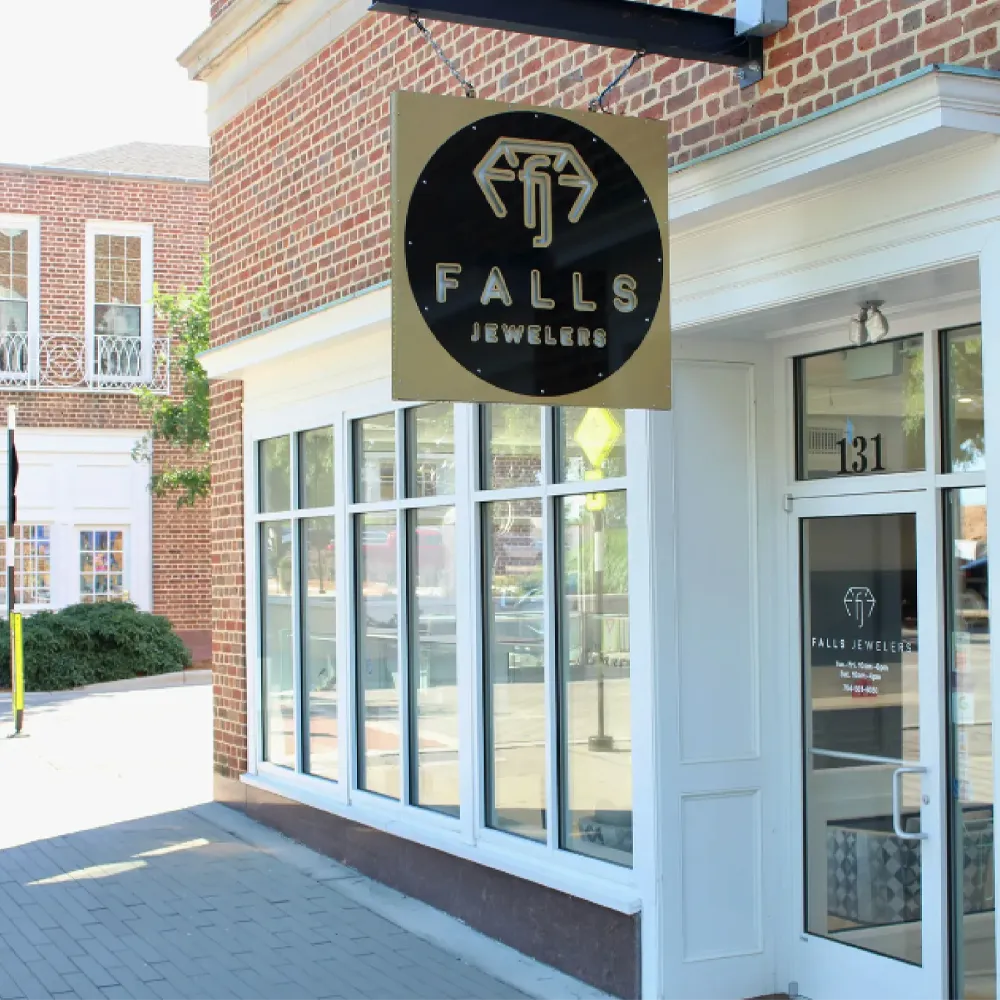 Falls Jewelers storefront in Kannapolis, NC, featuring a prominent sign and large windows. Visit for fine jewelry and watches.