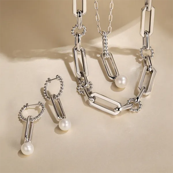 Stunning pearl jewelry set featuring earrings and a necklace. Shop pearl jewelry now!