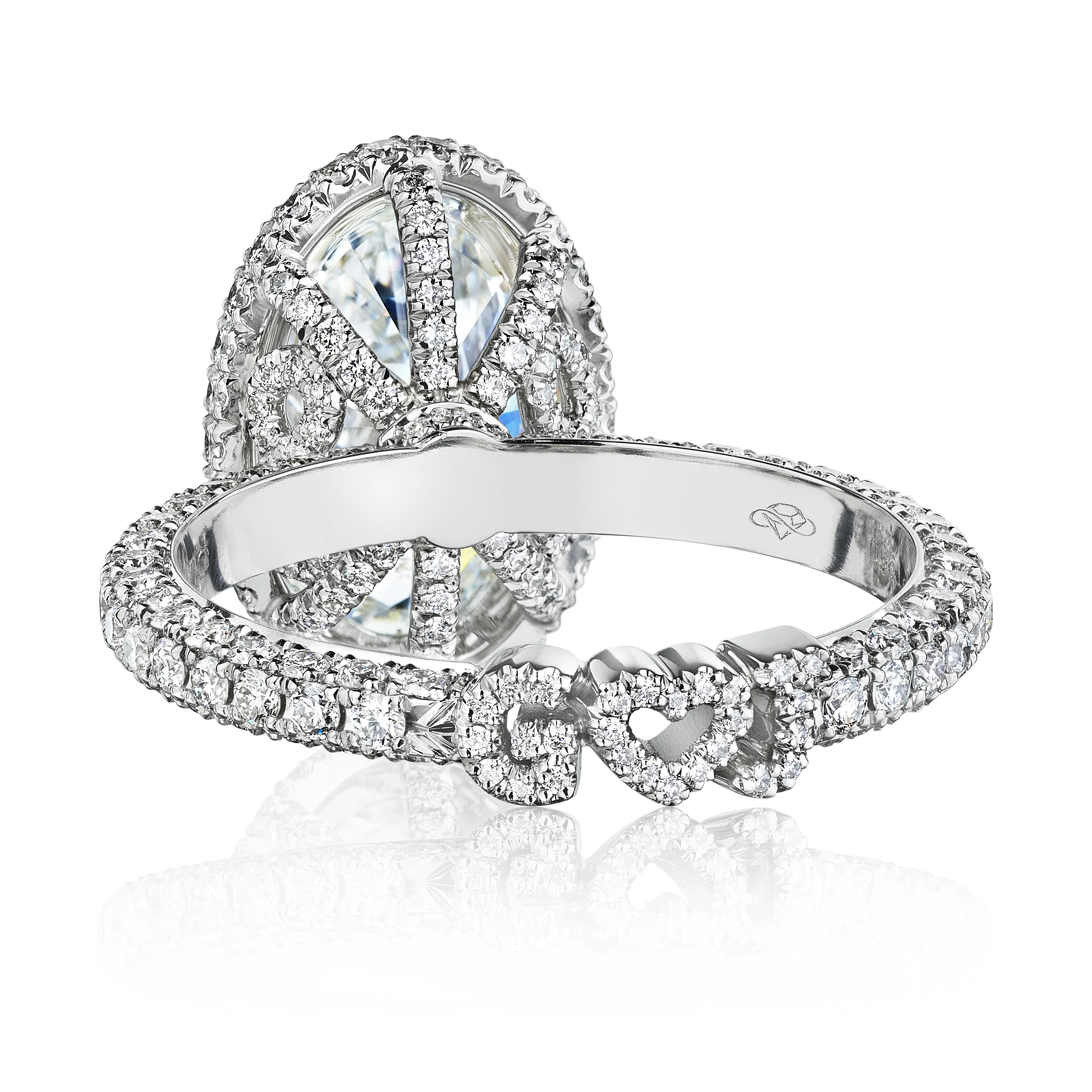 Round diamond engagment ring pictured with a round halo jacket addon