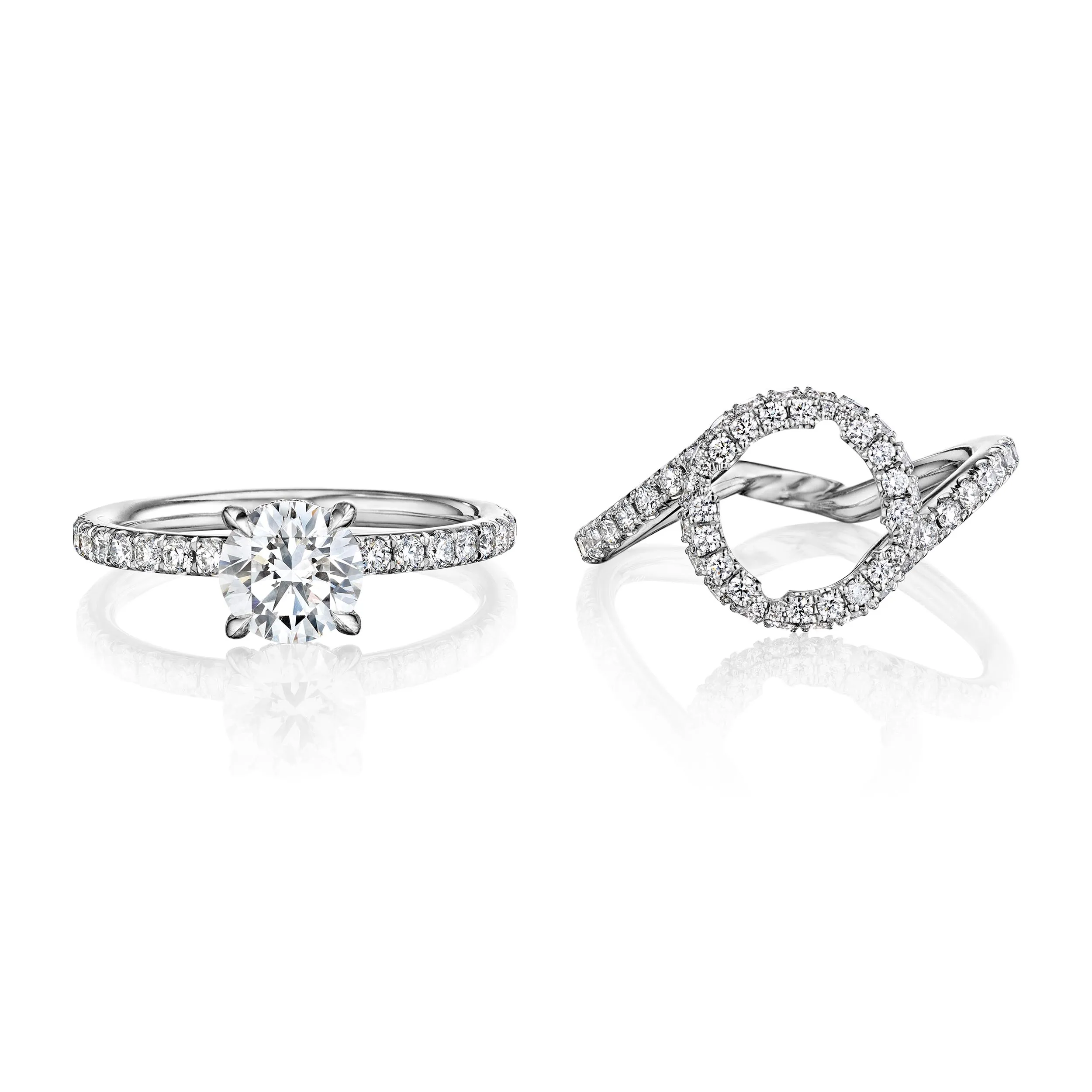 Round diamond engagment ring pictured with a round halo jacket addon
