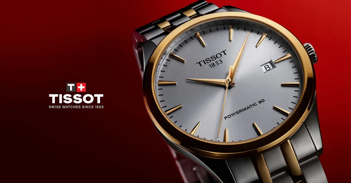 man with present box on his lap wearing a silver watch