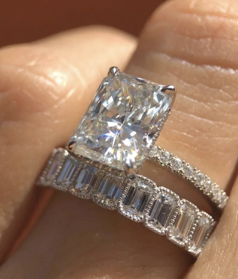 Stunning diamond engagement ring set featuring a large center stone and elegant band.