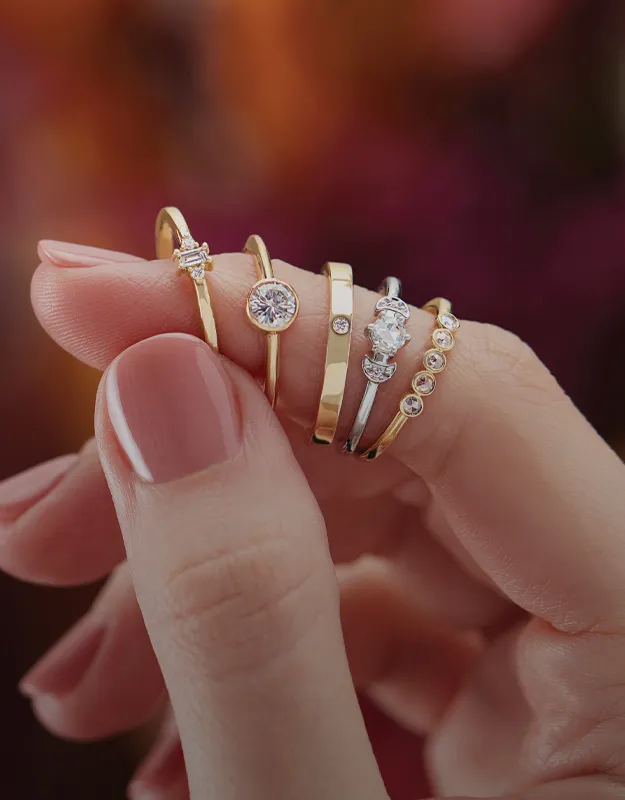 Elegant gold and silver rings with diamonds, displayed on a hand. Explore more at Futer Bros Jewelers - York's Home for Fine Jew