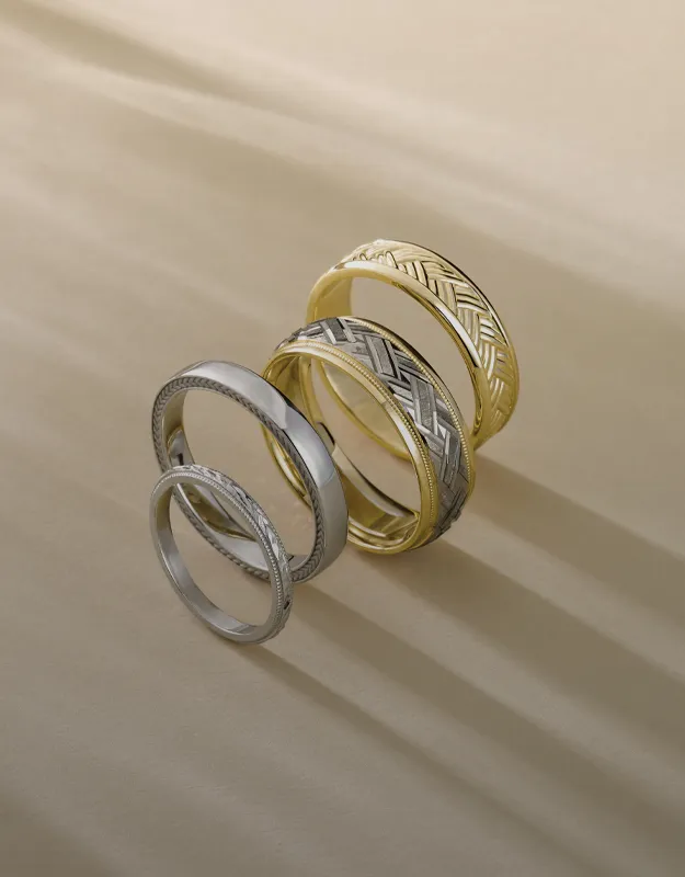 Stylish men's wedding bands in silver and gold. Click to explore more at Futer Bros Jewelers.