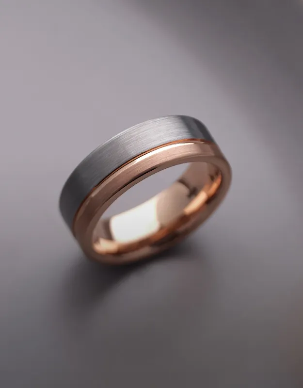Stylish men's wedding bands in silver and rose gold. Click to explore more at Futer Bros Jewelers.
