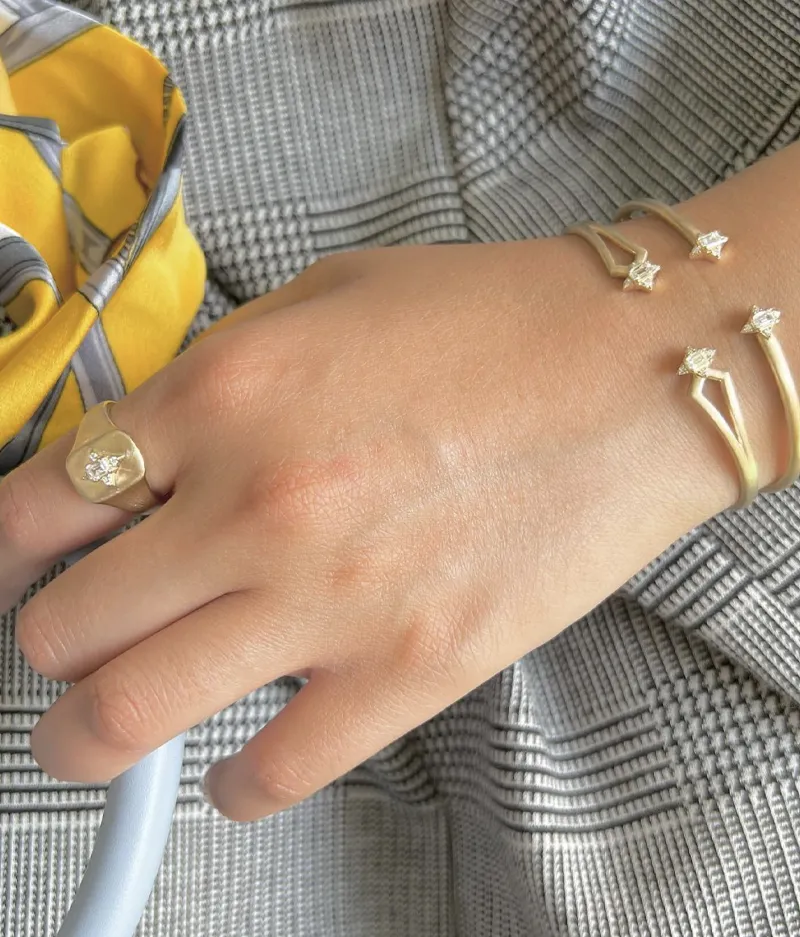 Stylish hand adorned with diamond bracelets and a ring from Futer Bros Jewelers. 