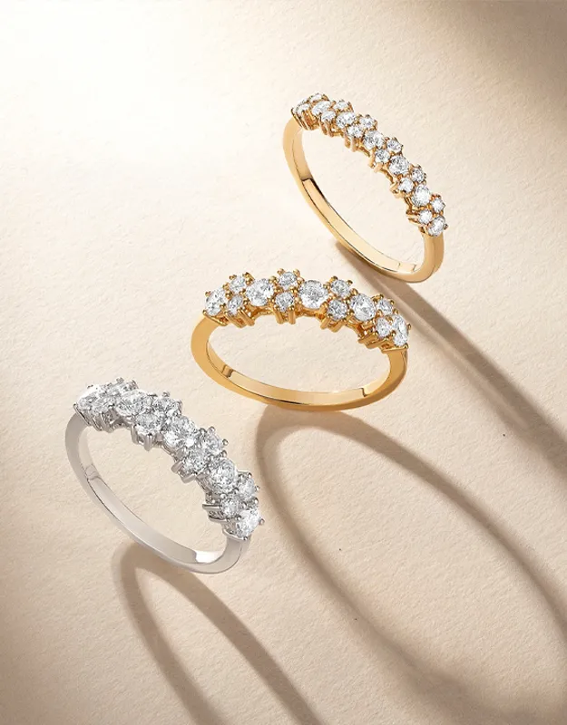 Three elegant diamond rings in gold and silver settings, showcasing a stunning jewelry collection. Click to explore more rings.