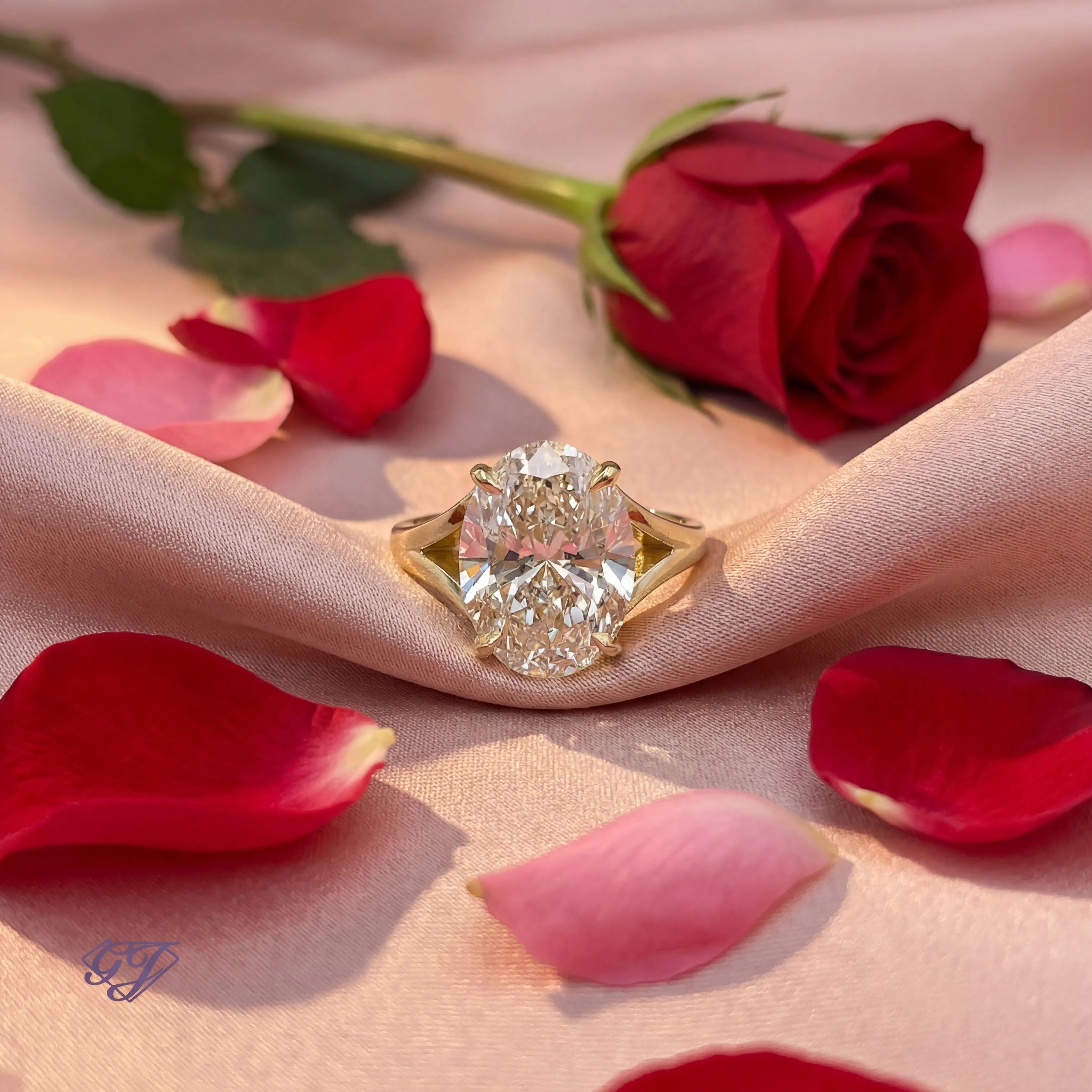 Elegant gold ring featuring a large pearl and diamond accents, displayed on a soft fabric background.