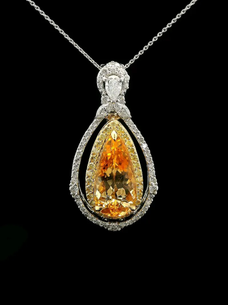 Elegant pendant necklace featuring a large orange gemstone surrounded by sparkling diamonds, perfect for any occasion.