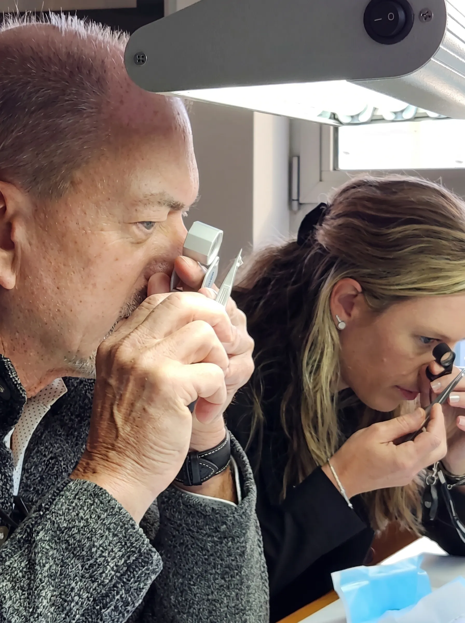 Scott examining diamonds with a loupe in the Antwerp Diamond District