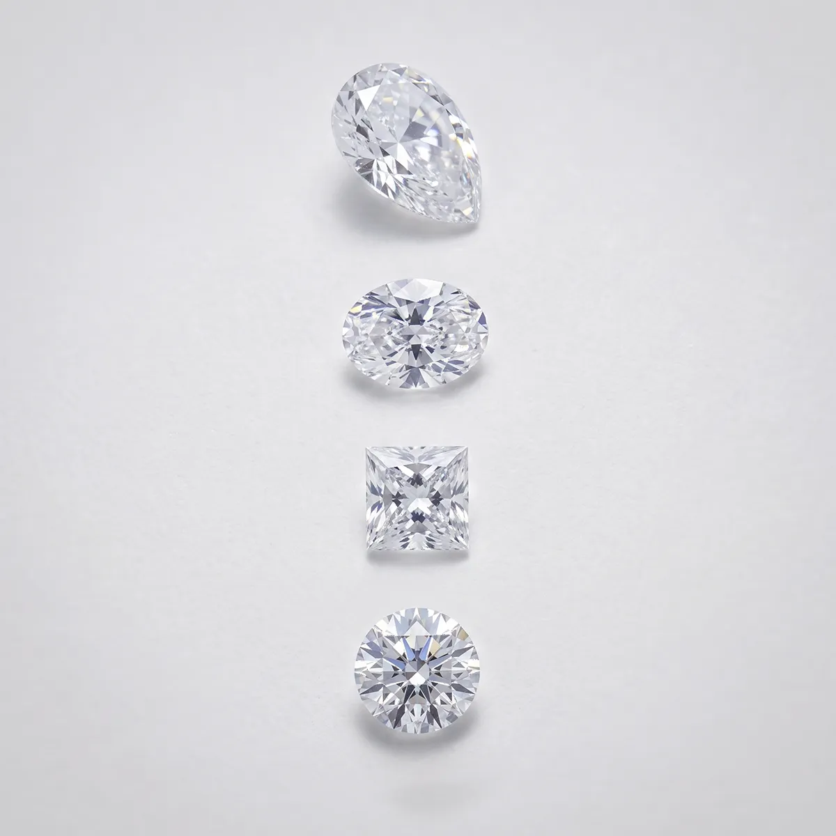 Elegant diamond ring with multiple rows of round stones on a reflective surface.